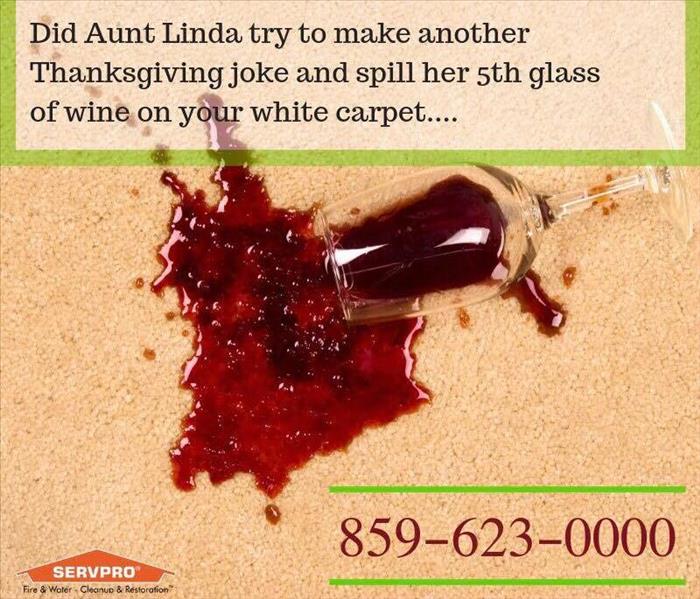 spilled wine glass on a white carpet