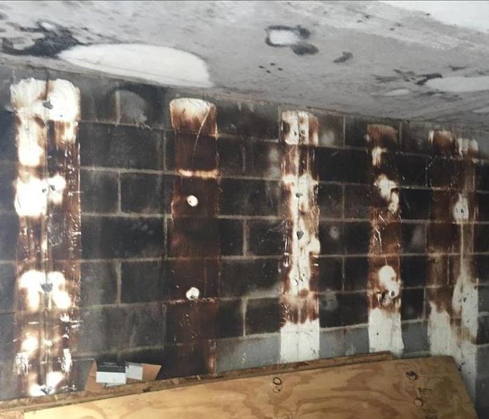 a fire damaged wall with soot and smoke damage 